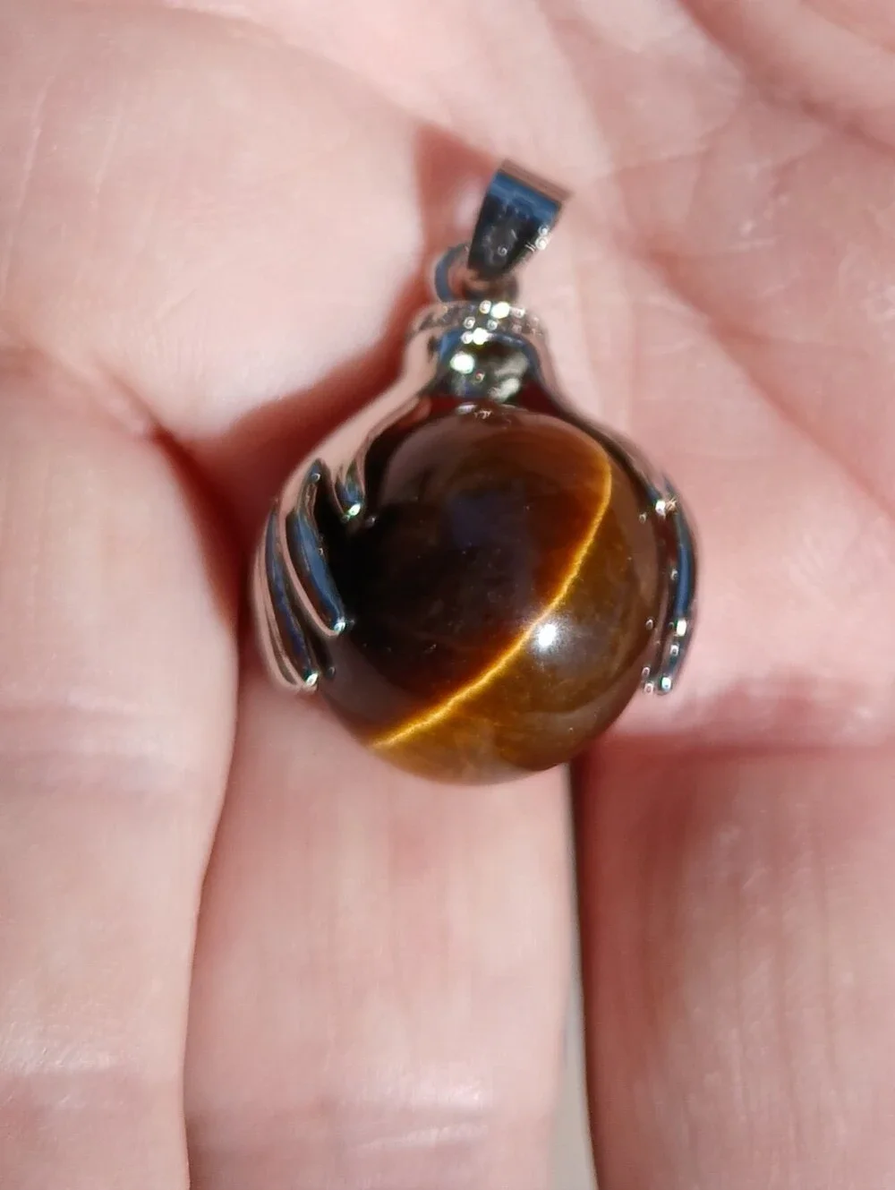 New 18K Hands Holding Tiger Eye Sphere Pendant.